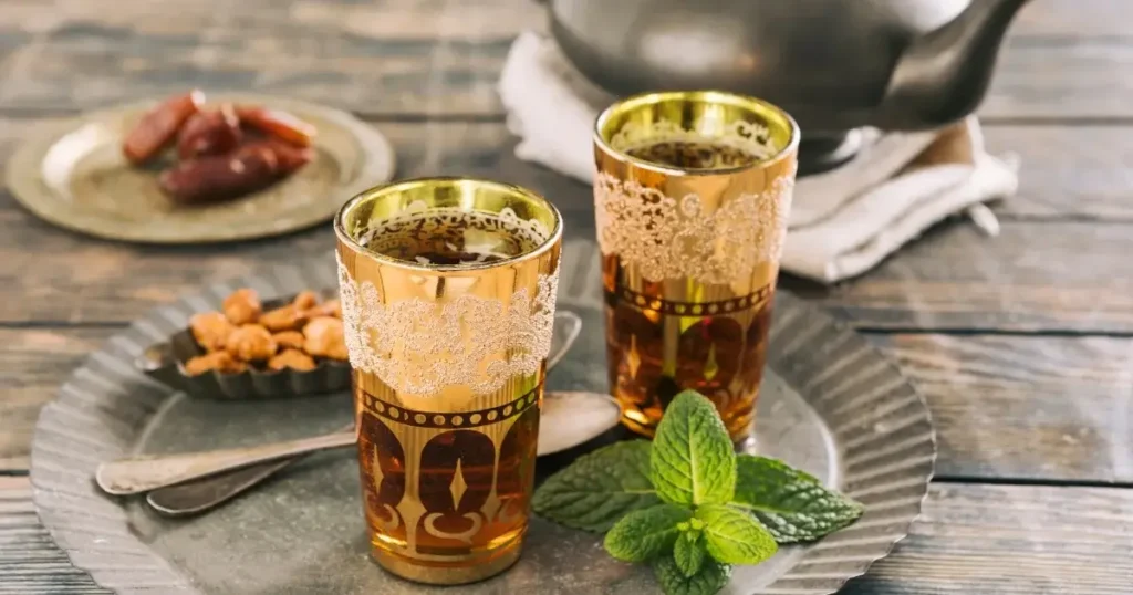Moroccan Family Enjoying Mint Tea in a Courtyard Setting